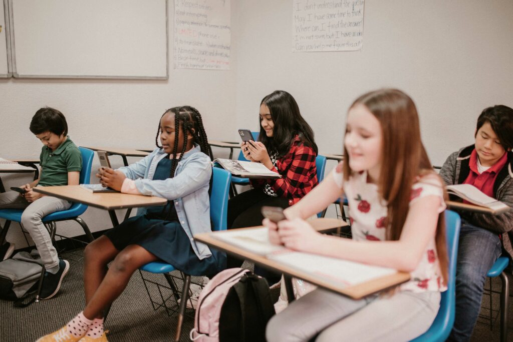 Kids using their phones in the classroom